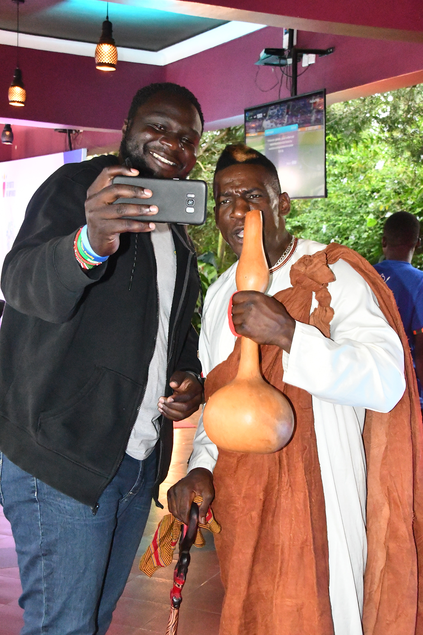 Kick boxer Golola Moses of Uganda takes a selfie with a fan during the Ekyooto Ha Mpango Cultural Festival in Fort Portal Tourism City. Photo by EDGAR R. BATTE