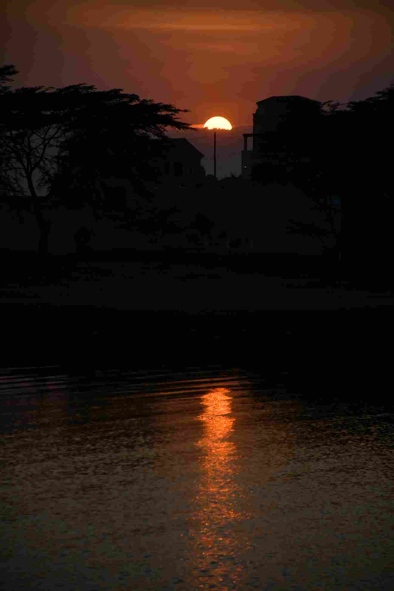 The sun sets over Lake Victoria as seen from Kigo